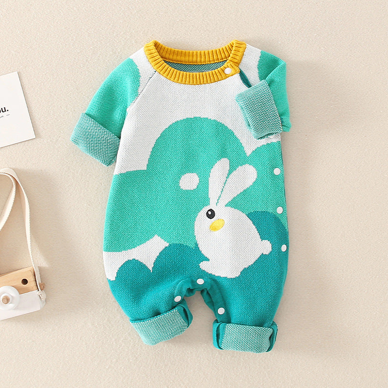 A cozy handknit romper for babies featuring a charming autumn rabbit pattern in green cotton fabric, suitable for both genders.