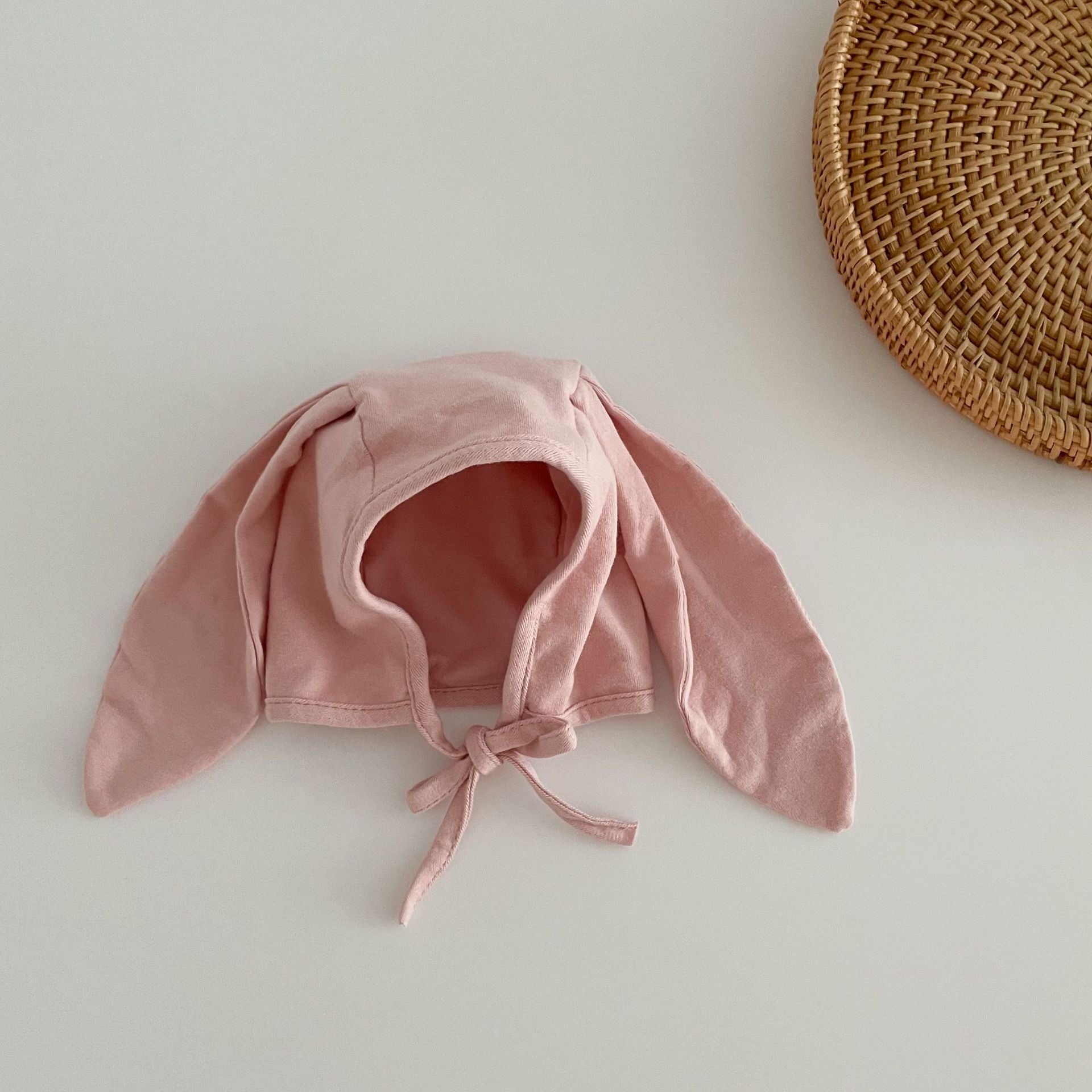 Adorable Autumn Rabbits Design Hat for Baby with tie straps, available in various colors, made from soft cotton blend material.