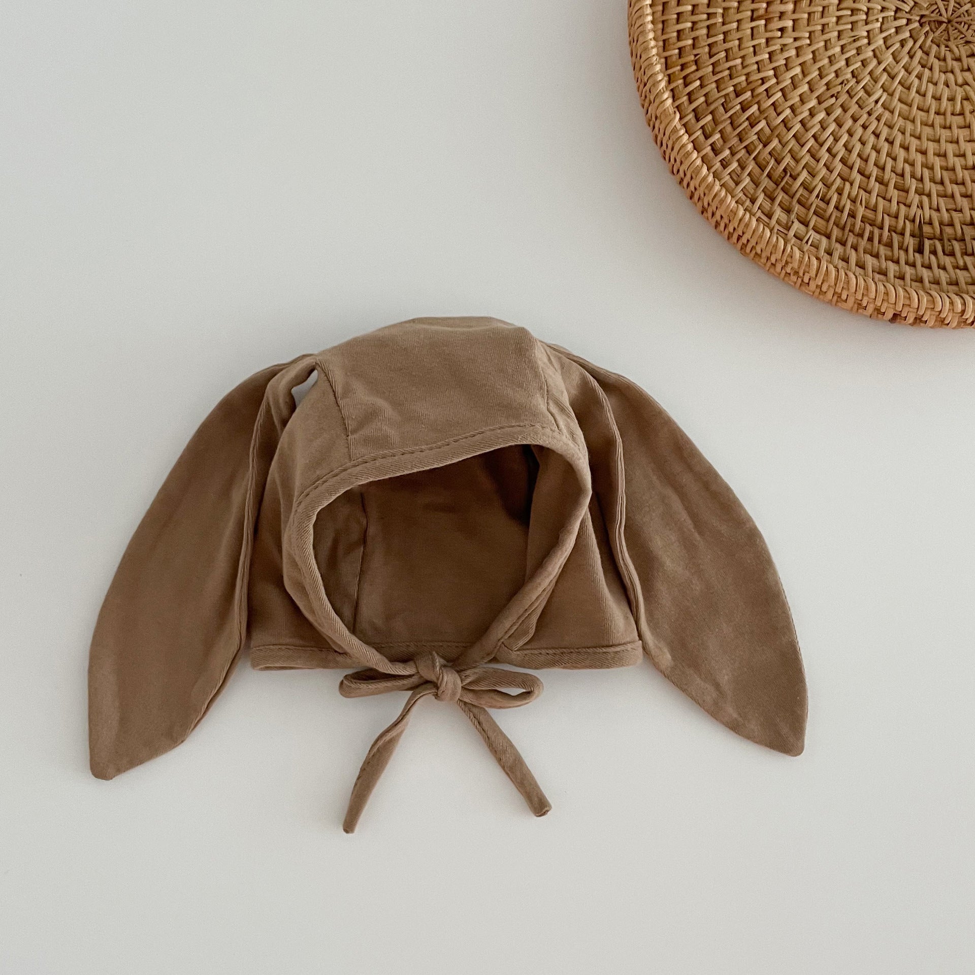 Adorable Autumn Rabbits Design Hat for Baby with tie straps, available in various colors, made from soft cotton blend material.