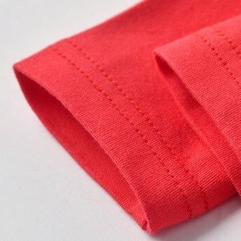 A stylish Baby Bow Tie Patched Onesie Bodysuit in vibrant colors, featuring a bow tie and patchwork design, perfect for special occasions.