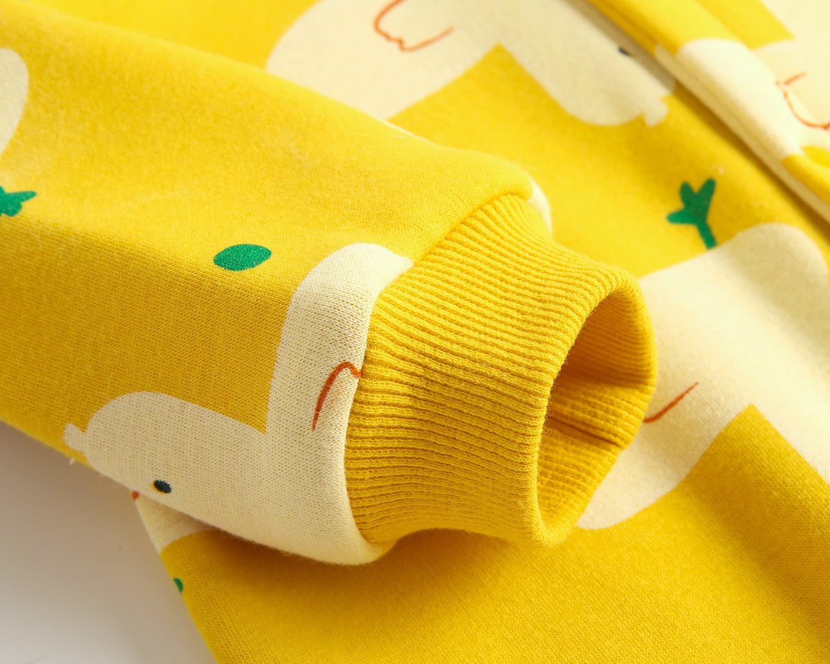 Baby wearing a cute cartoon duck print romper with matching hat, showcasing vibrant colors and playful design.