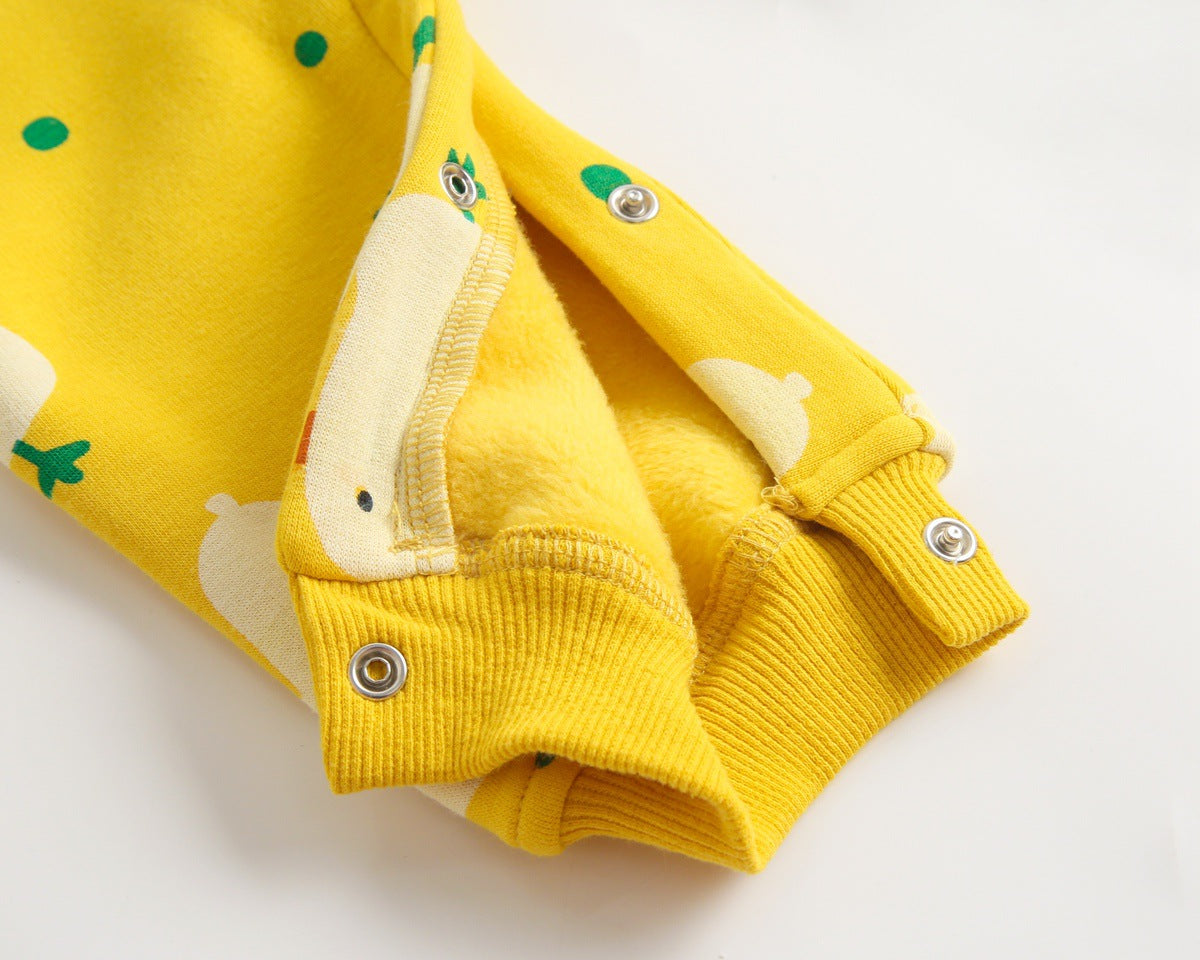 Baby wearing a cute cartoon duck print romper with matching hat, showcasing vibrant colors and playful design.