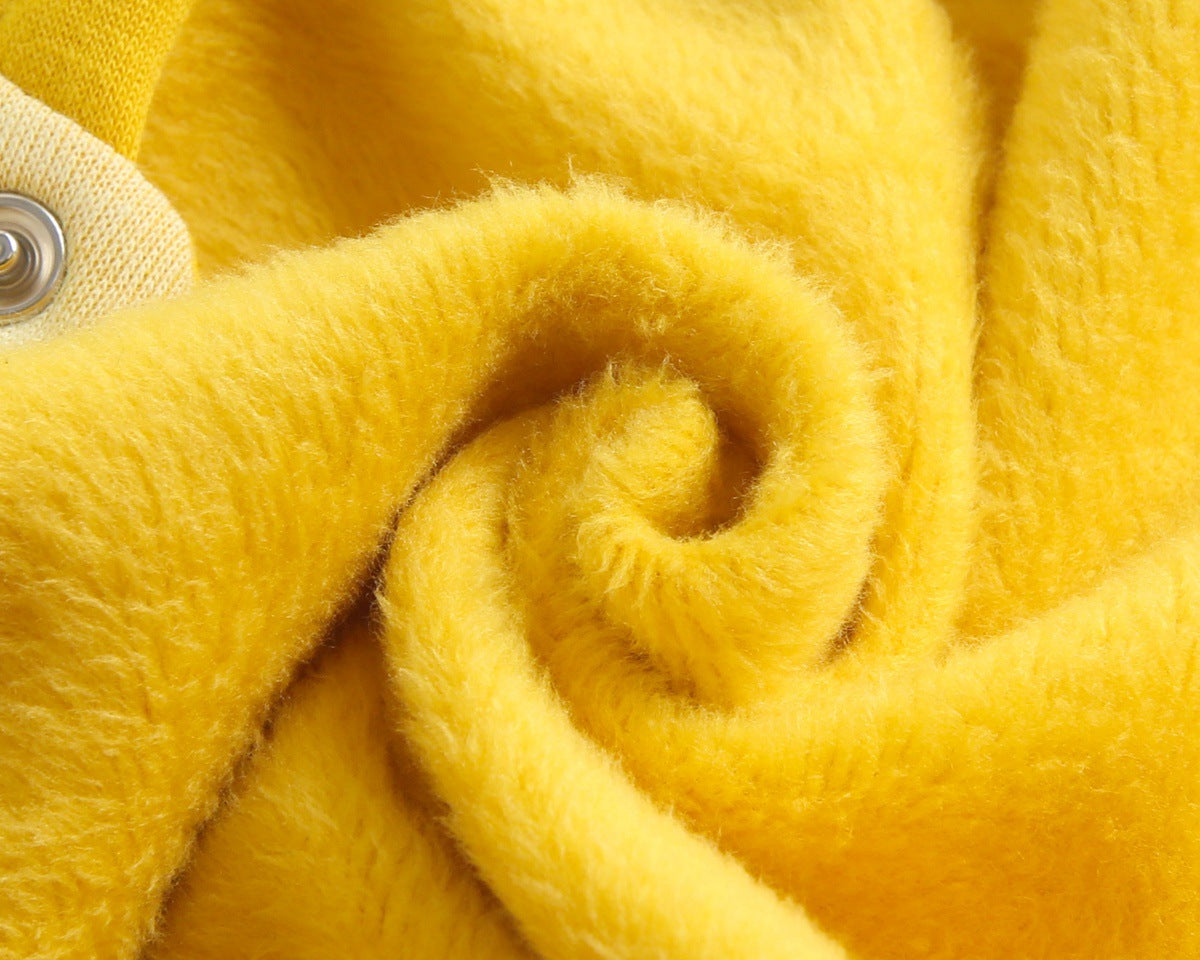 Baby wearing a cute cartoon duck print romper with matching hat, showcasing vibrant colors and playful design.