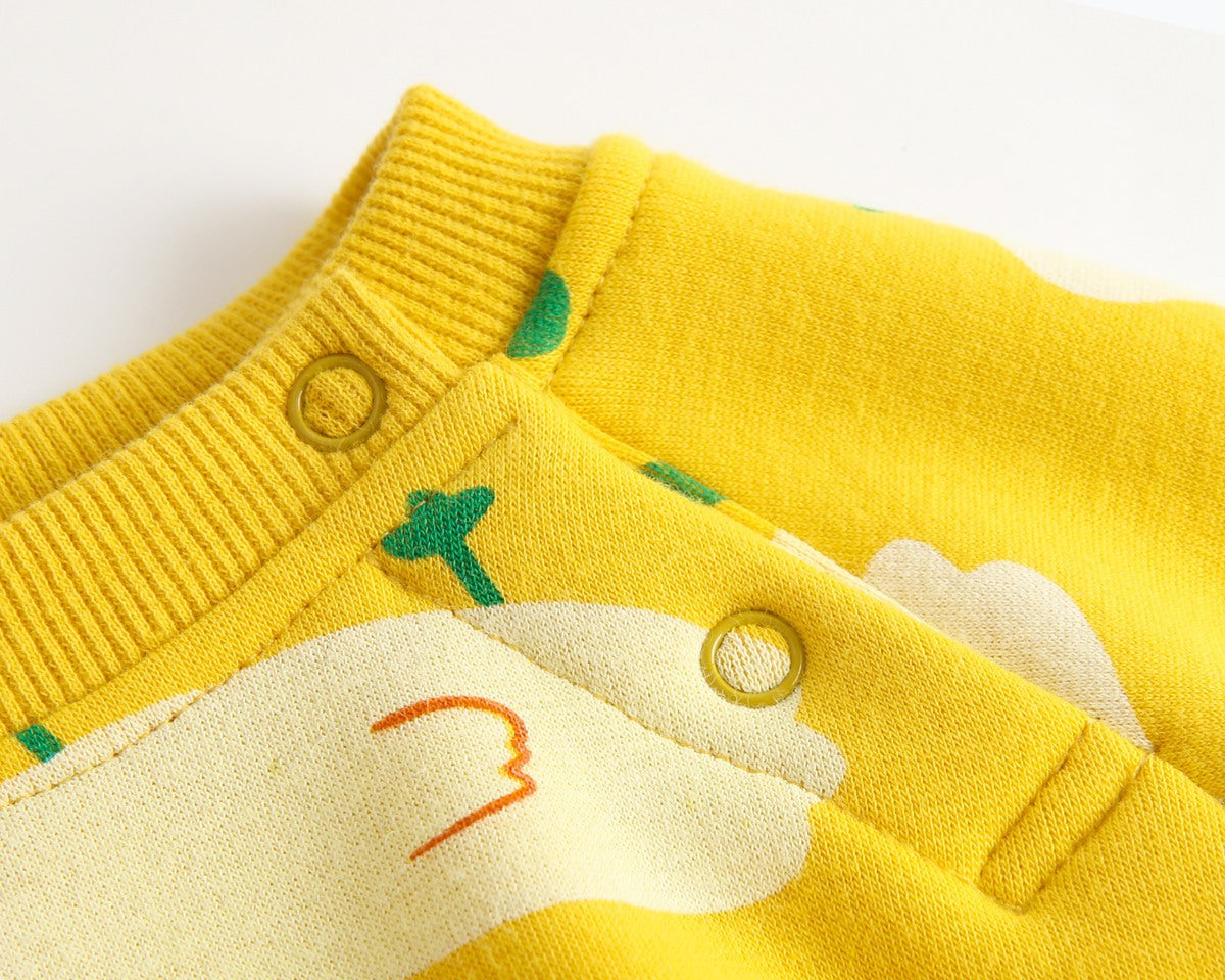 Baby wearing a cute cartoon duck print romper with matching hat, showcasing vibrant colors and playful design.