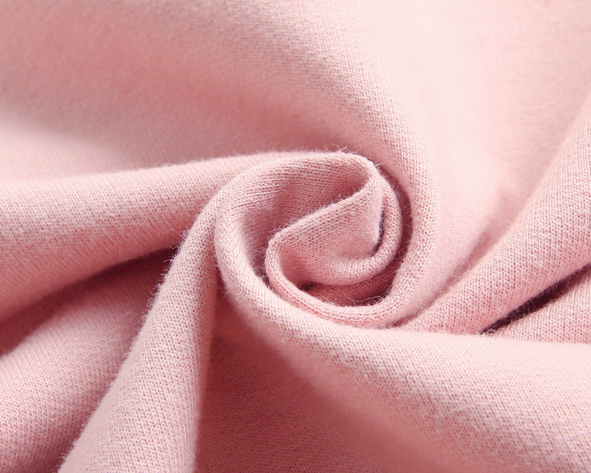 Baby wearing a long-sleeved cartoon print cotton onesie with a matching hat, showcasing a playful design in pink, grey, and brown colors.