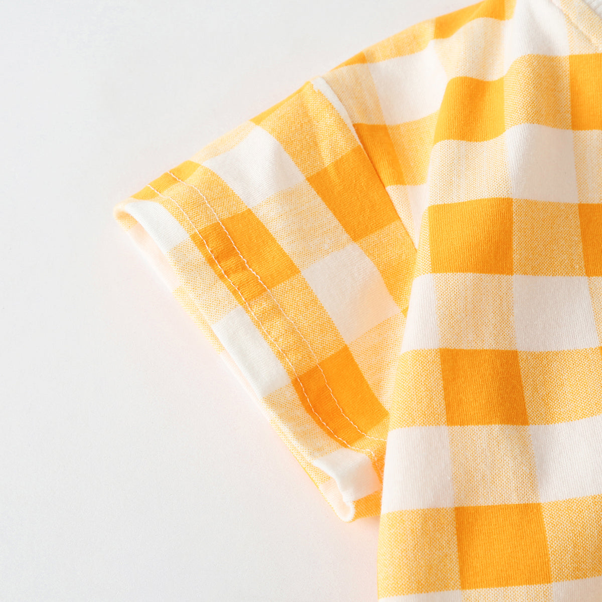 Baby outfit featuring plaid and heart patterns in a tee and shorts set, available in white and yellow colors.