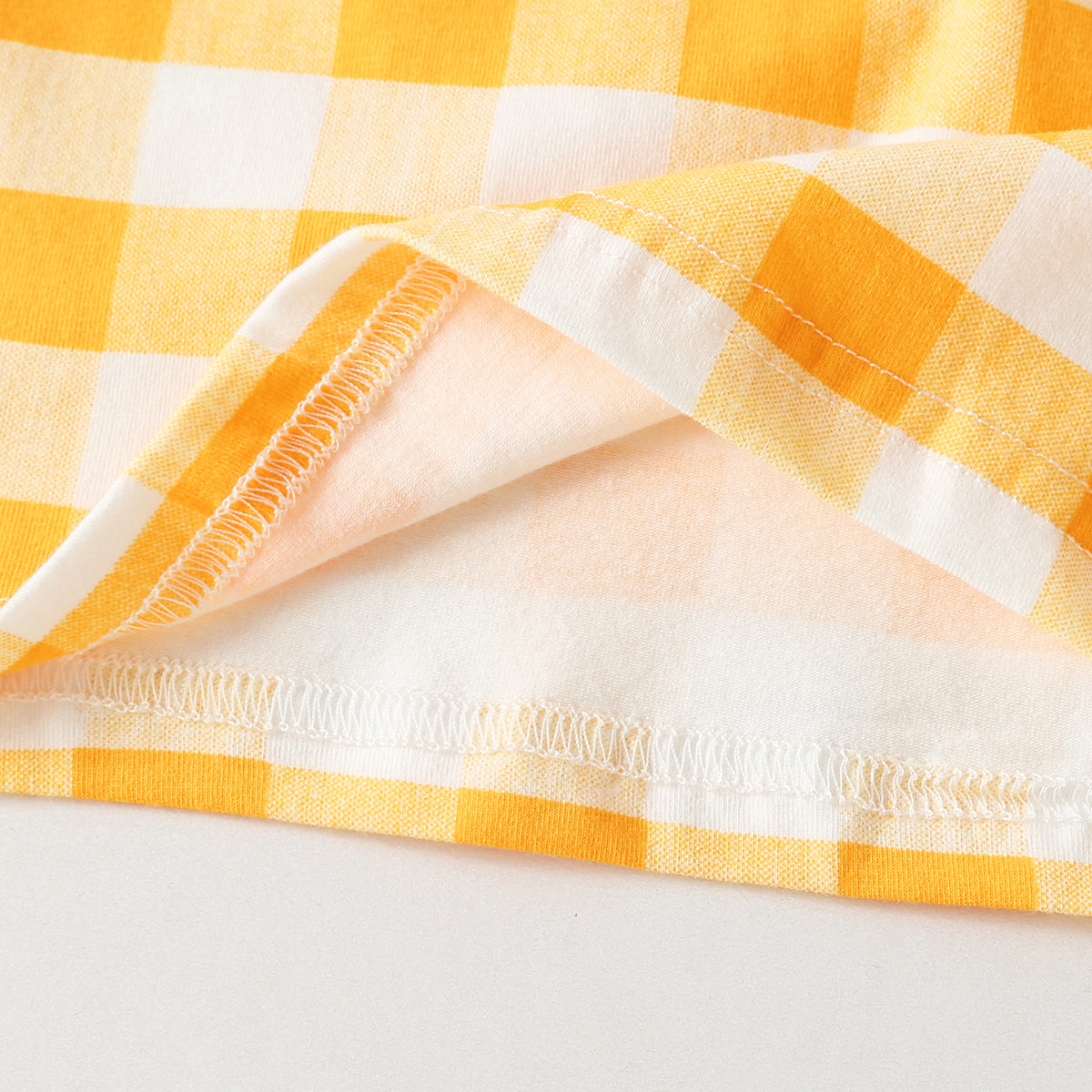 Baby outfit featuring plaid and heart patterns in a tee and shorts set, available in white and yellow colors.