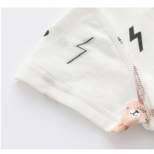 Baby wearing a soft bamboo rabbit graphic jumpsuit in white, showcasing a playful design perfect for summer.