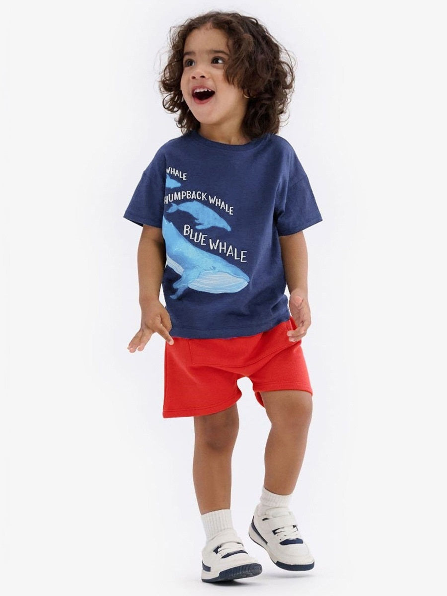 Baby and kids boys casual outfit featuring a whale cartoon design in navy blue, consisting of a short sleeves top and matching shorts.