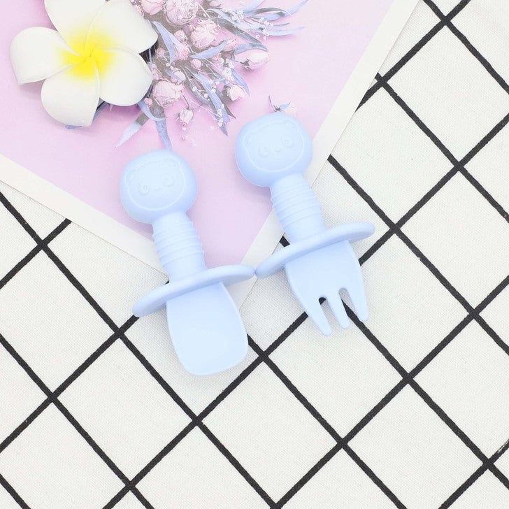 A colorful set of Baby Bear Pattern Silicone Spoons and Forks for children, featuring various colors and a cute bear design, perfect for training toddlers.