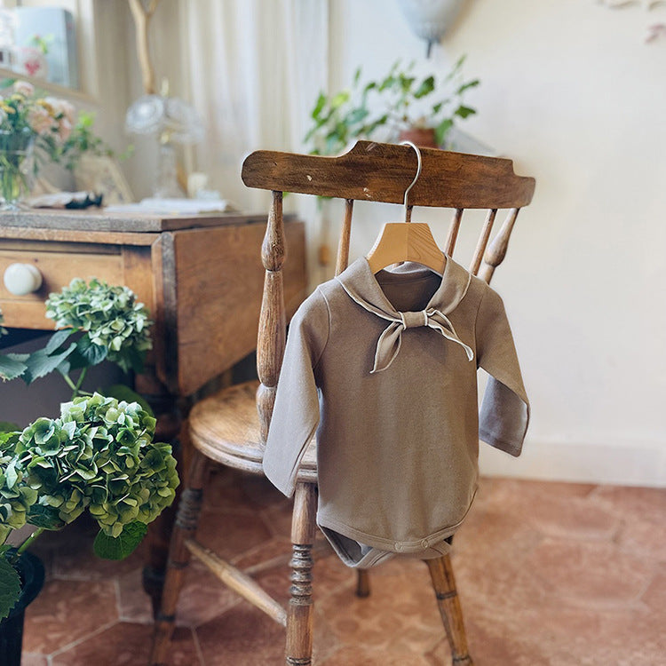 Baby Bow Tie Design Long Sleeve Bodysuit in white and coffee colors, showcasing a cute bow tie detail.