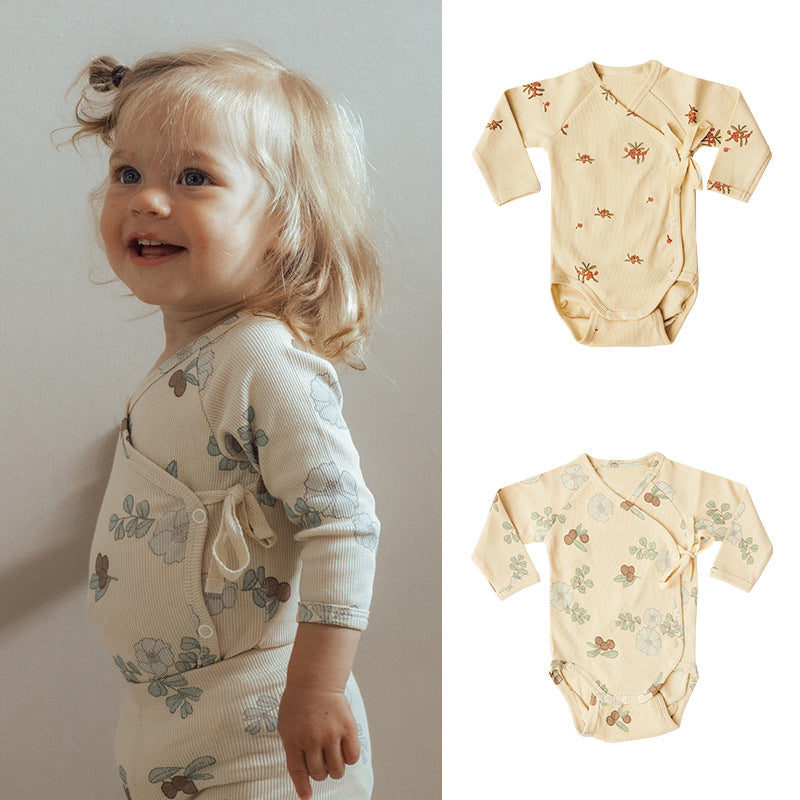 Baby boy and girl onesie featuring a floral pattern and side belt design, made from soft cotton fabric.
