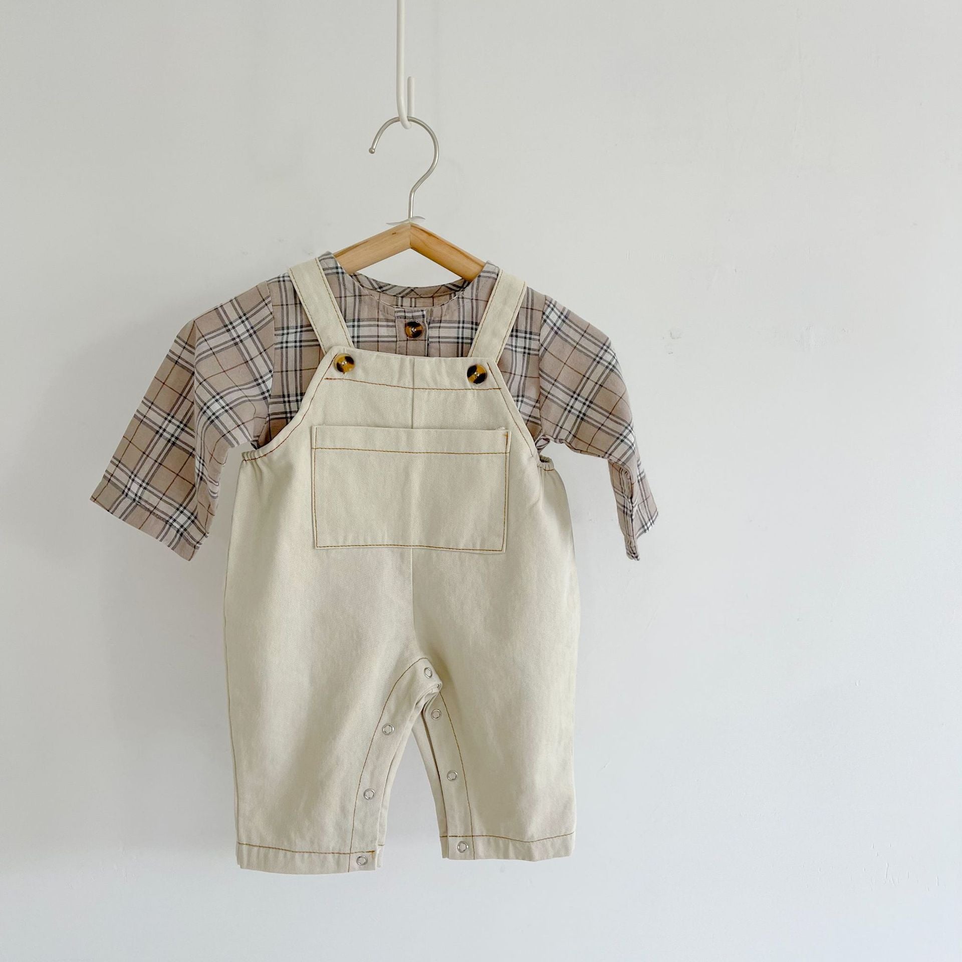 Baby boy and girl plaid pattern long-sleeved top combo with denim straps, showcasing a stylish and comfortable outfit for infants.