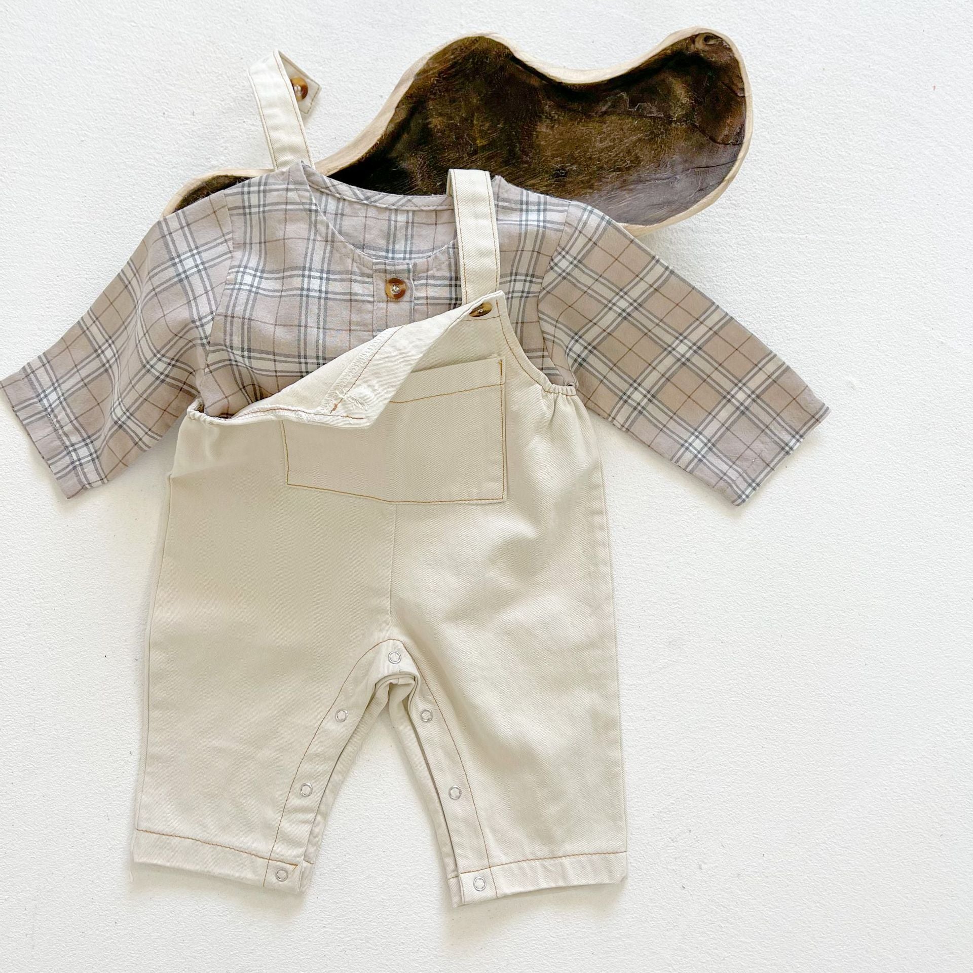 Baby boy and girl plaid pattern long-sleeved top combo with denim straps, showcasing a stylish and comfortable outfit for infants.