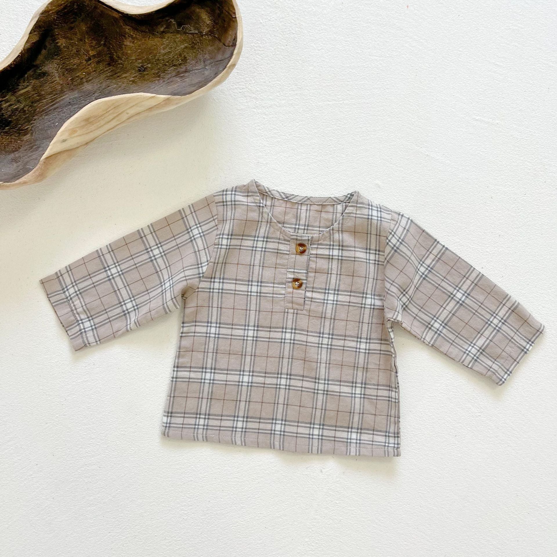Baby boy and girl plaid pattern long-sleeved top combo with denim straps, showcasing a stylish and comfortable outfit for infants.