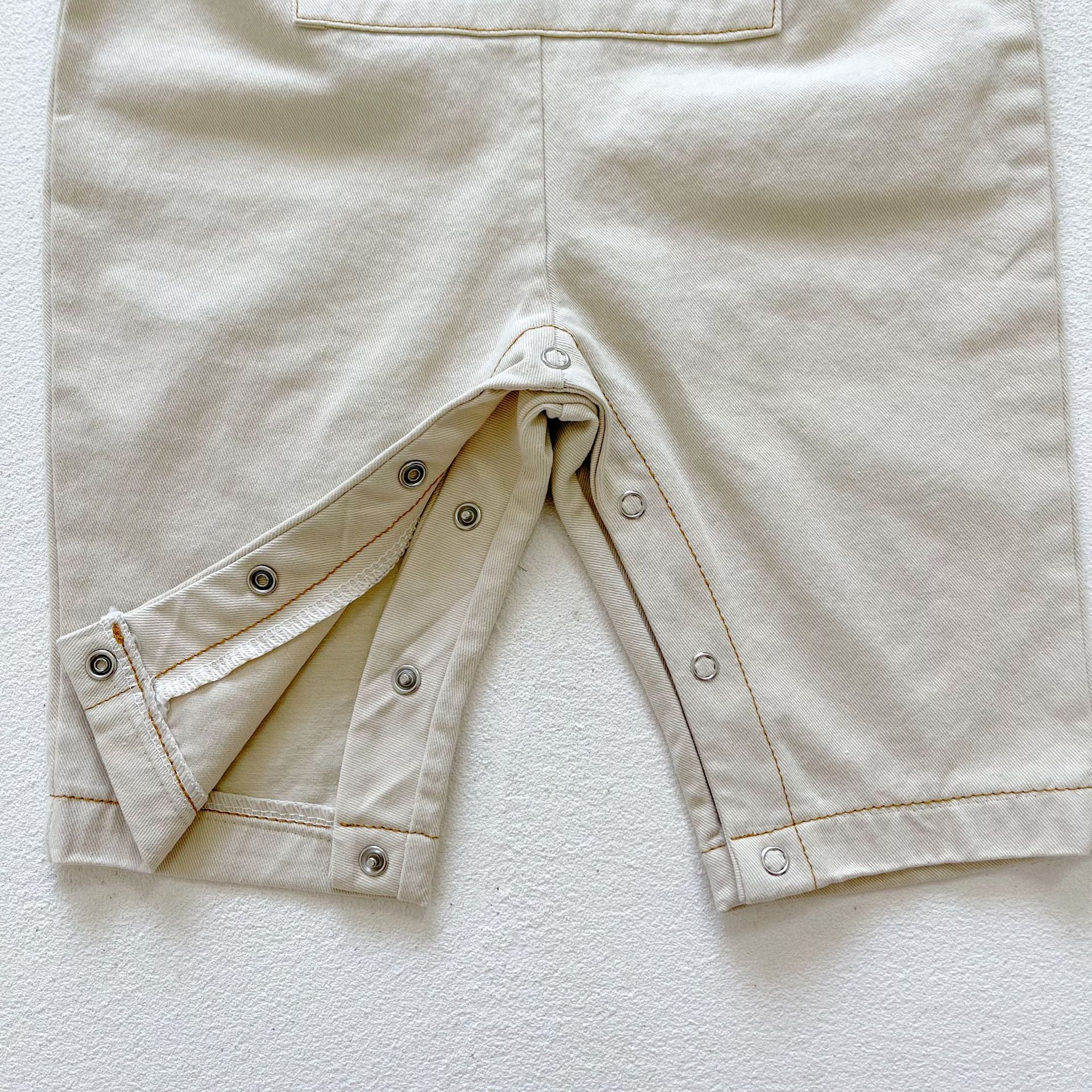 Baby boy and girl plaid pattern long-sleeved top combo with denim straps, showcasing a stylish and comfortable outfit for infants.