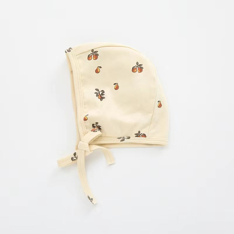 A cozy Baby Boy And Girl Print Pattern Belt Design Cotton Tire Cap Warm Hat in various colors with an adorable animal print, perfect for toddlers.