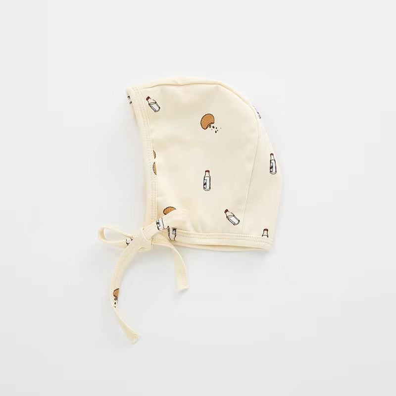 A cozy Baby Boy And Girl Print Pattern Belt Design Cotton Tire Cap Warm Hat in various colors with an adorable animal print, perfect for toddlers.