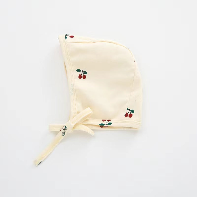 A cozy Baby Boy And Girl Print Pattern Belt Design Cotton Tire Cap Warm Hat in various colors with an adorable animal print, perfect for toddlers.