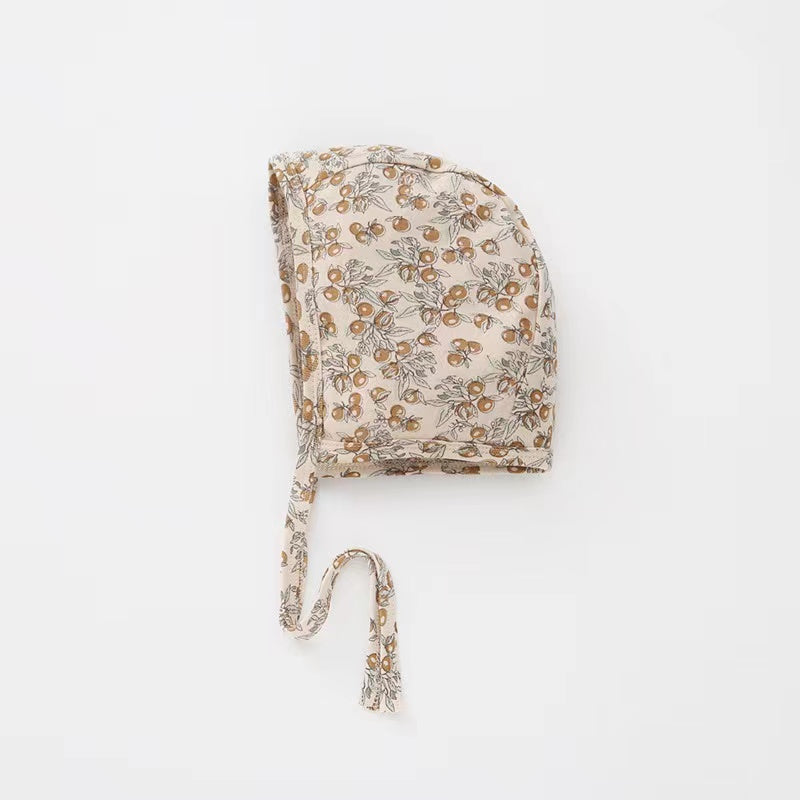 A cozy Baby Boy And Girl Print Pattern Belt Design Cotton Tire Cap Warm Hat in various colors with an adorable animal print, perfect for toddlers.