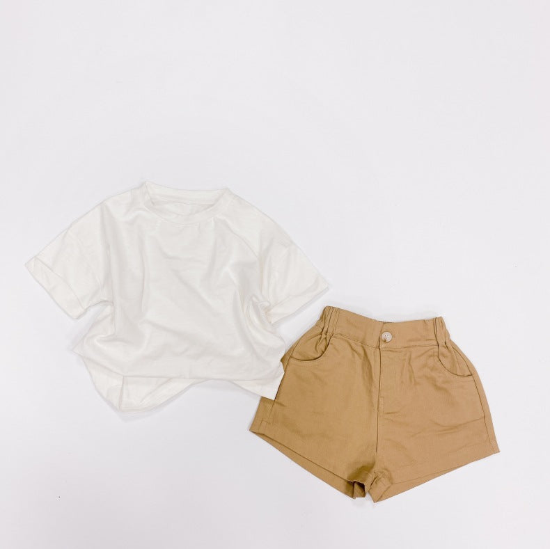 Baby boy and girl solid color denim shorts with pockets, available in white, black, khaki, and brown, perfect for summer wear.
