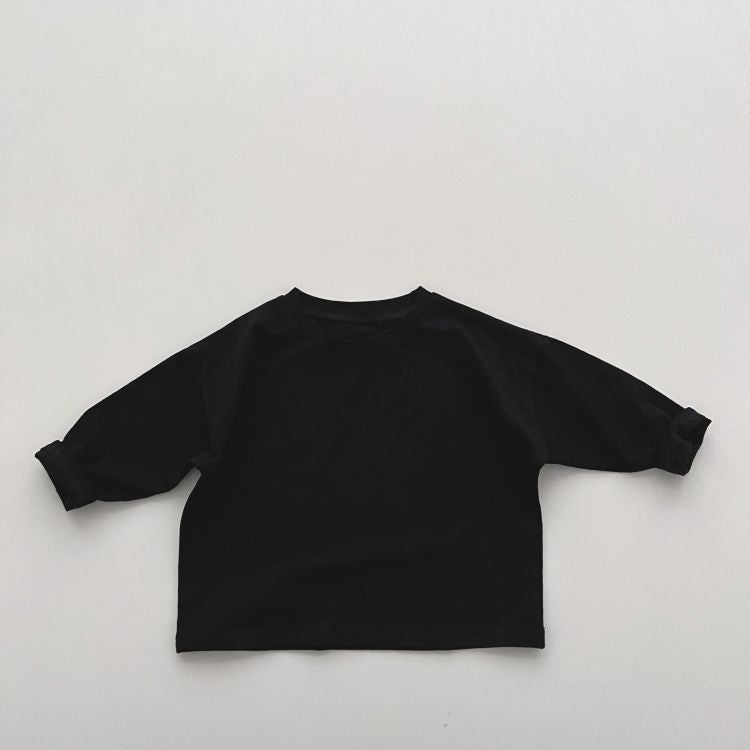 Baby boy and girl solid color pullover tops in white, black, and coffee, showcasing long sleeves and soft cotton fabric.