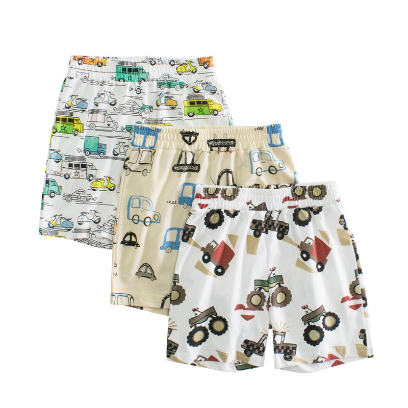 Baby boy shorts featuring a colorful car print pattern, made from breathable cotton fabric, perfect for summer wear.