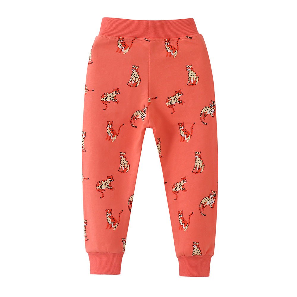 Baby boy soft cotton trousers featuring a cartoon animal pattern in vibrant orange color, perfect for playful days.