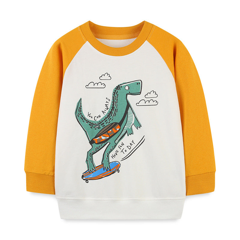 Baby boy wearing a colorful cotton hoodie with a cartoon dinosaur pattern, perfect for playful adventures.