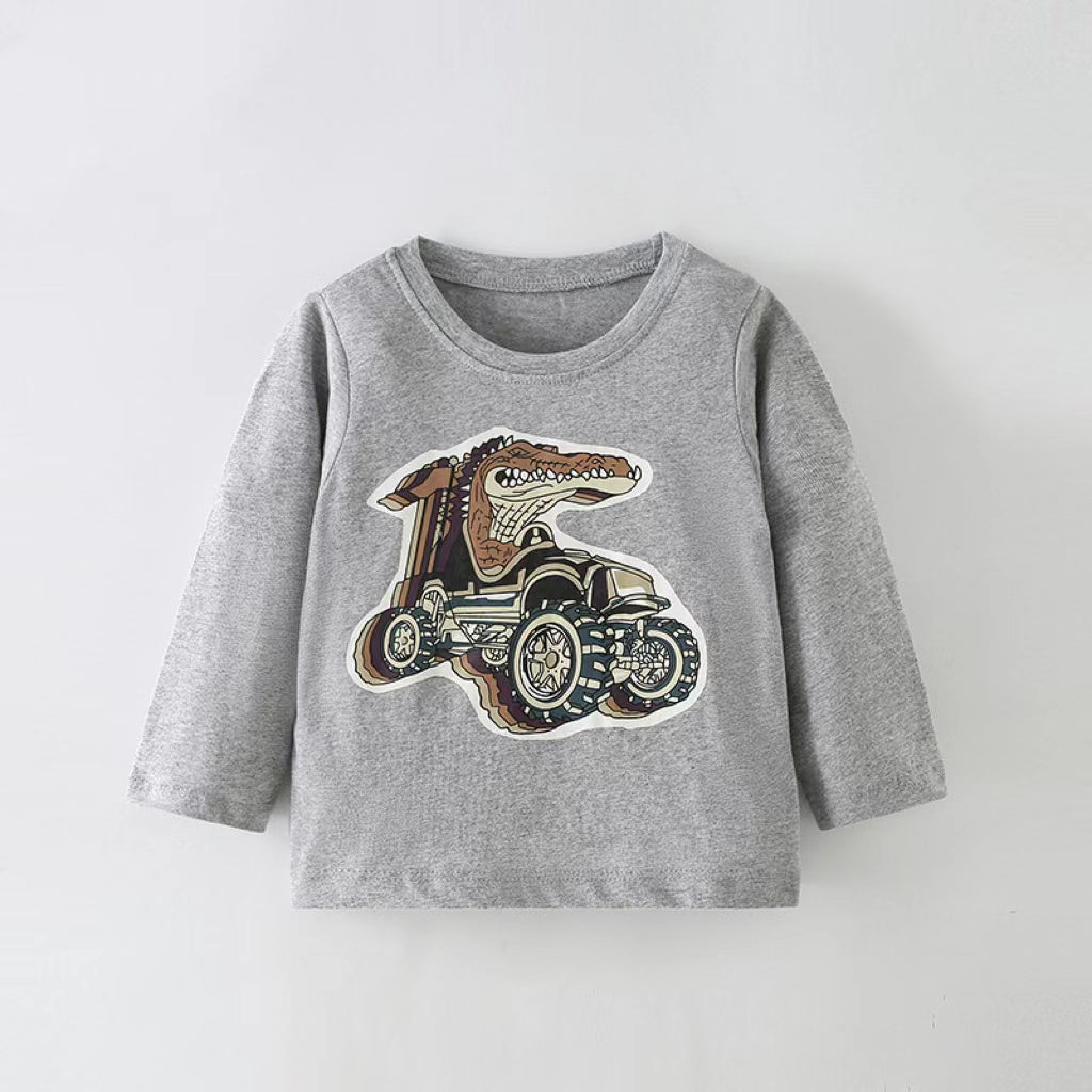 Baby boy wearing a grey long sleeve shirt with cartoon graphics and western style detailing.