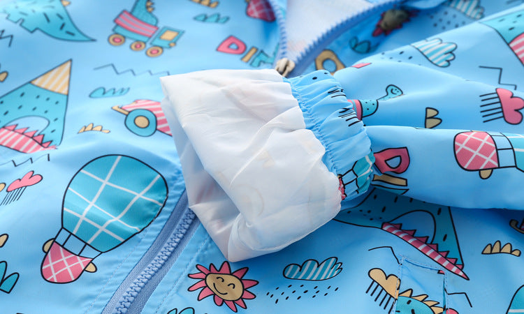 Baby boy wearing a cartoon pattern zipper front mesh cloth jacket coat in various colors, showcasing its playful design and comfortable fit.