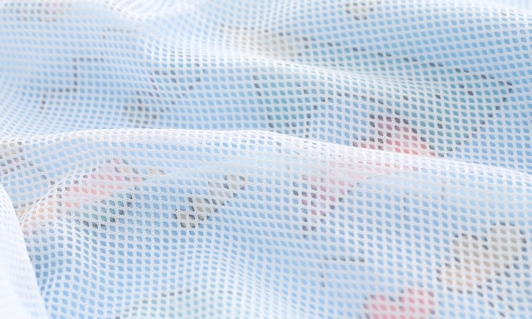 Baby boy wearing a cartoon pattern zipper front mesh cloth jacket coat in various colors, showcasing its playful design and comfortable fit.