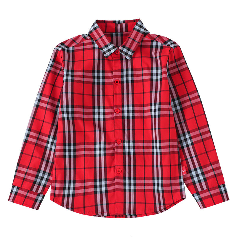 A stylish baby boy wearing a classic plaid pattern button front lapel shirt in red, green, and beige colors.