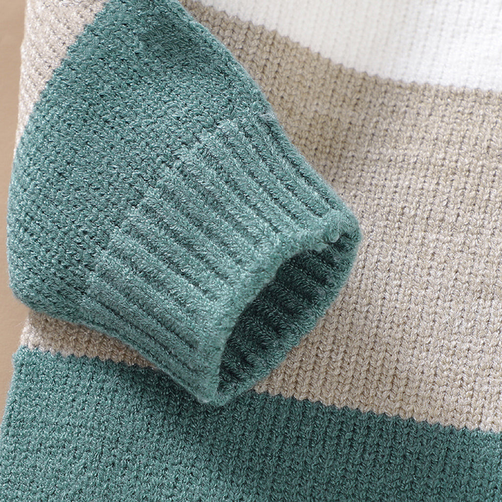 Baby boy wearing a stylish color block pullover with quarter-button design in blue and green, perfect for spring and autumn.