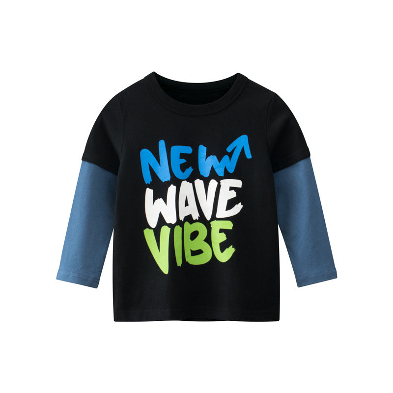 A colorful long-sleeved shirt for baby boys featuring a vibrant blue and orange design with slogan prints and patchwork details.