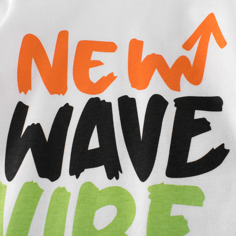 A colorful long-sleeved shirt for baby boys featuring a vibrant blue and orange design with slogan prints and patchwork details.