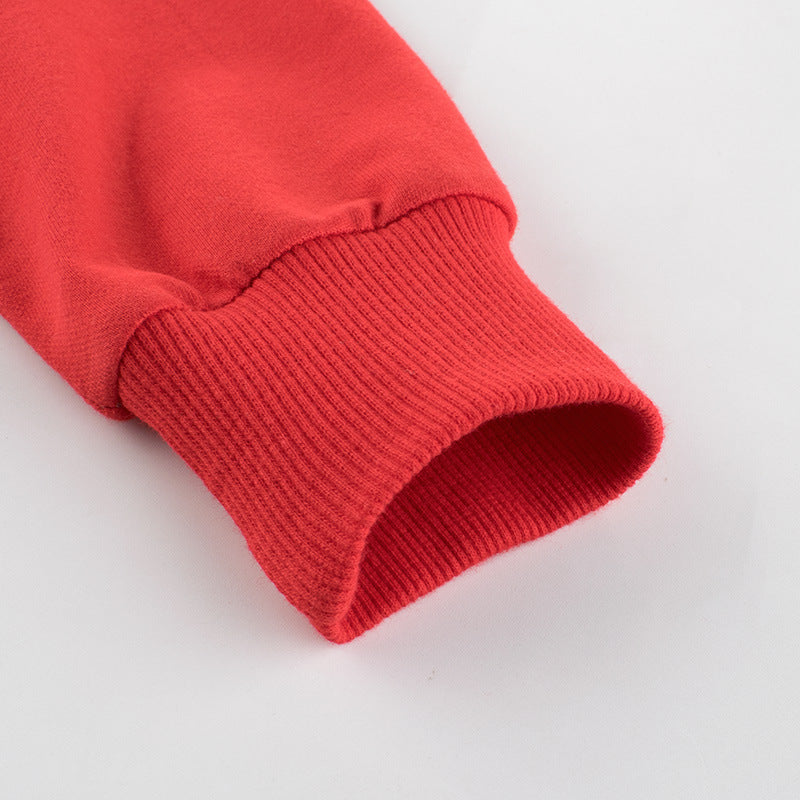 Baby boy wearing a stylish contrast design hoodie with side print trousers, showcasing vibrant colors and a playful striped pattern.