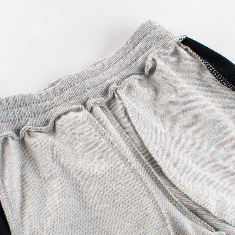 Baby boy wearing a stylish contrast design hoodie with side print trousers, showcasing vibrant colors and a playful striped pattern.