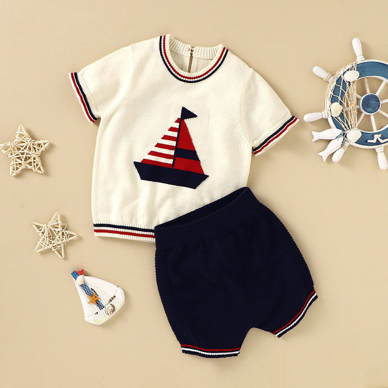 Baby boy wearing a striped tee with embroidered graphic and comfy shorts, perfect for summer outings.