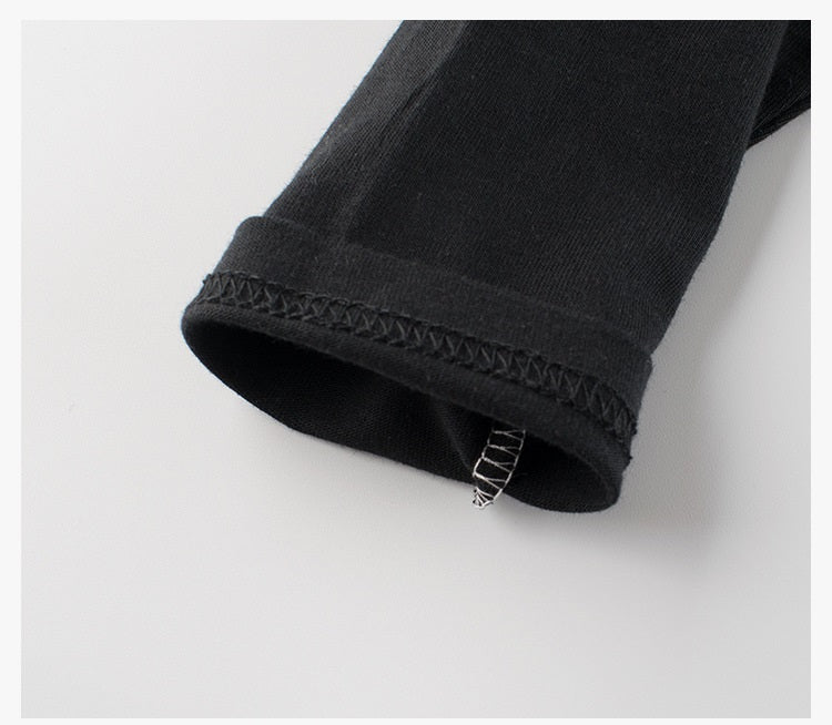 Baby boy's navy blue long sleeve shirt featuring leopard cartoon and letters print, made from soft cotton material.