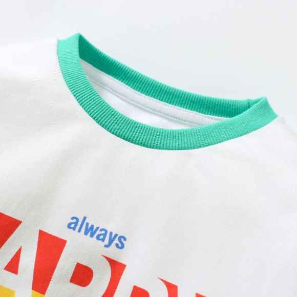 Baby boy wearing a blue hoodie with letter pattern and patchwork design, showcasing comfort and style.