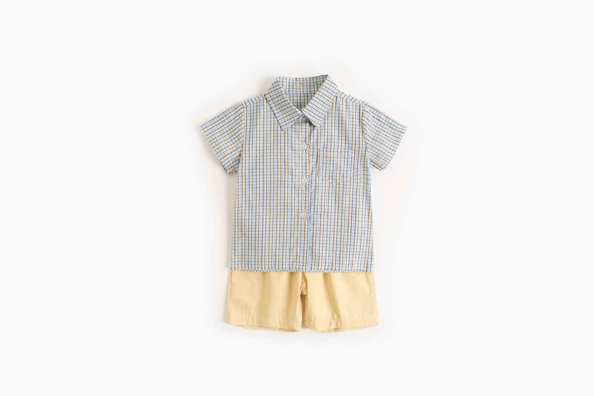 Baby boy wearing a stylish plaid pattern polo-neck shirt and shorts combo in vibrant colors.