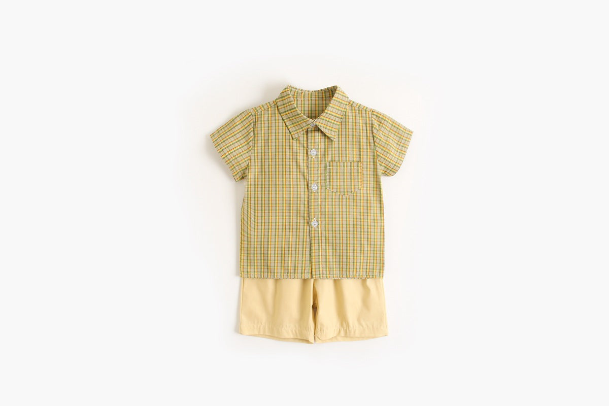 Baby boy wearing a stylish plaid pattern polo-neck shirt and shorts combo in vibrant colors.