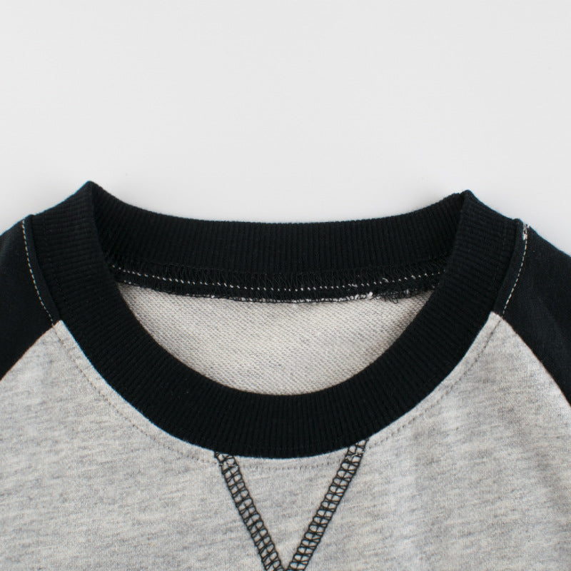A grey baby boy pullover featuring a side striped pattern in contrasting colors, perfect for spring and autumn wear.