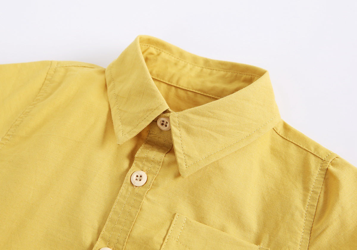 Baby boy solid color buttoned shirt with pockets, available in white, blue, and yellow, perfect for summer wear.