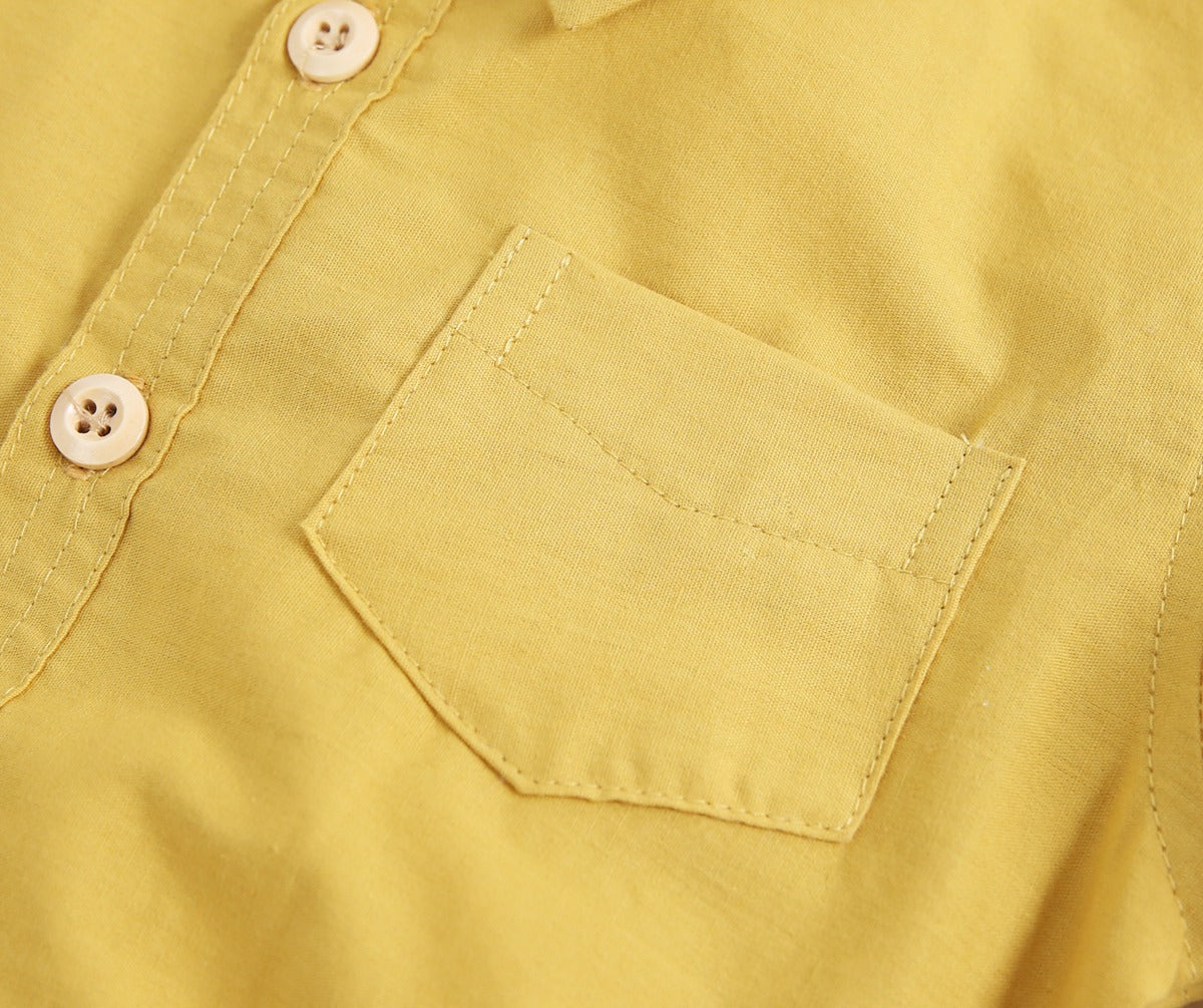 Baby boy solid color buttoned shirt with pockets, available in white, blue, and yellow, perfect for summer wear.