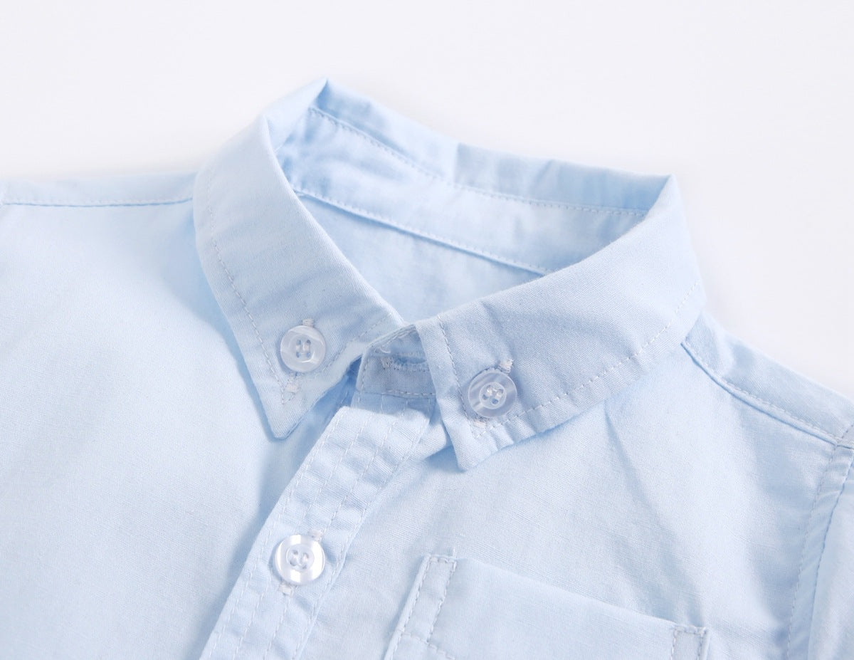 Baby boy solid color buttoned shirt with pockets, available in white, blue, and yellow, perfect for summer wear.