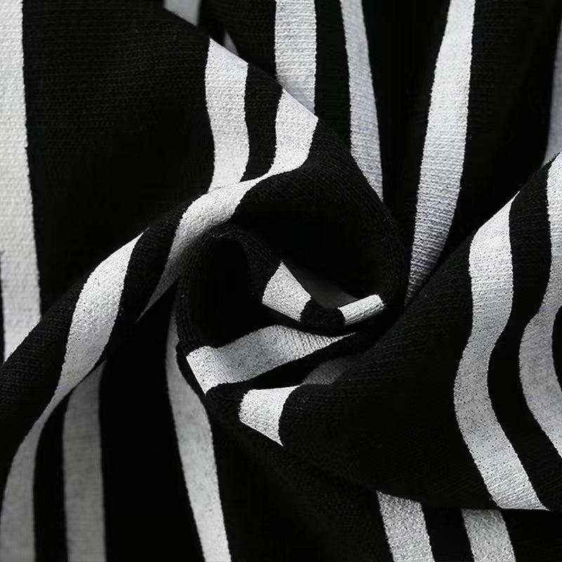 Baby boy wearing a stylish striped pattern hoodie with cartoon print, showcasing comfort and playful design.