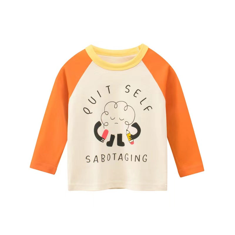 A colorful baby top featuring a print pattern and color patchwork design, perfect for spring wear.