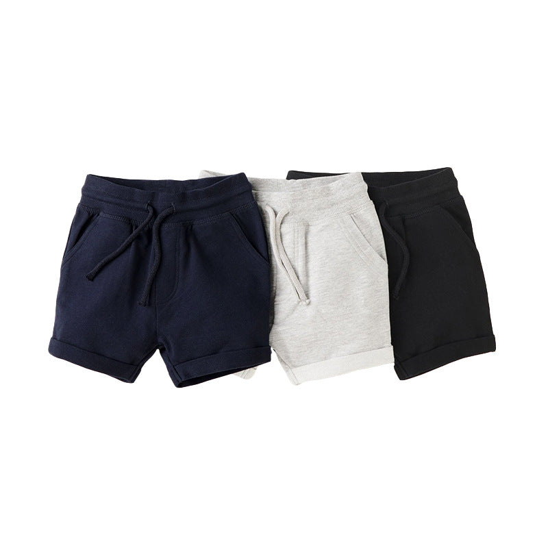 Baby boys solid color soft cotton sport style shorts in black, navy blue, and grey, showcasing their comfortable and stylish design.